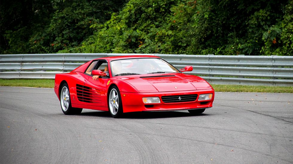 The 512 of the early 1990s gave the Testarossa a subtle facelift, but the high-mounted mirror of the early cars was long gone.