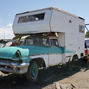 Sometimes your local junkyard offers the utterly unexpected, such as a '56 Mercury camper next to a Fiat 850 Spider.