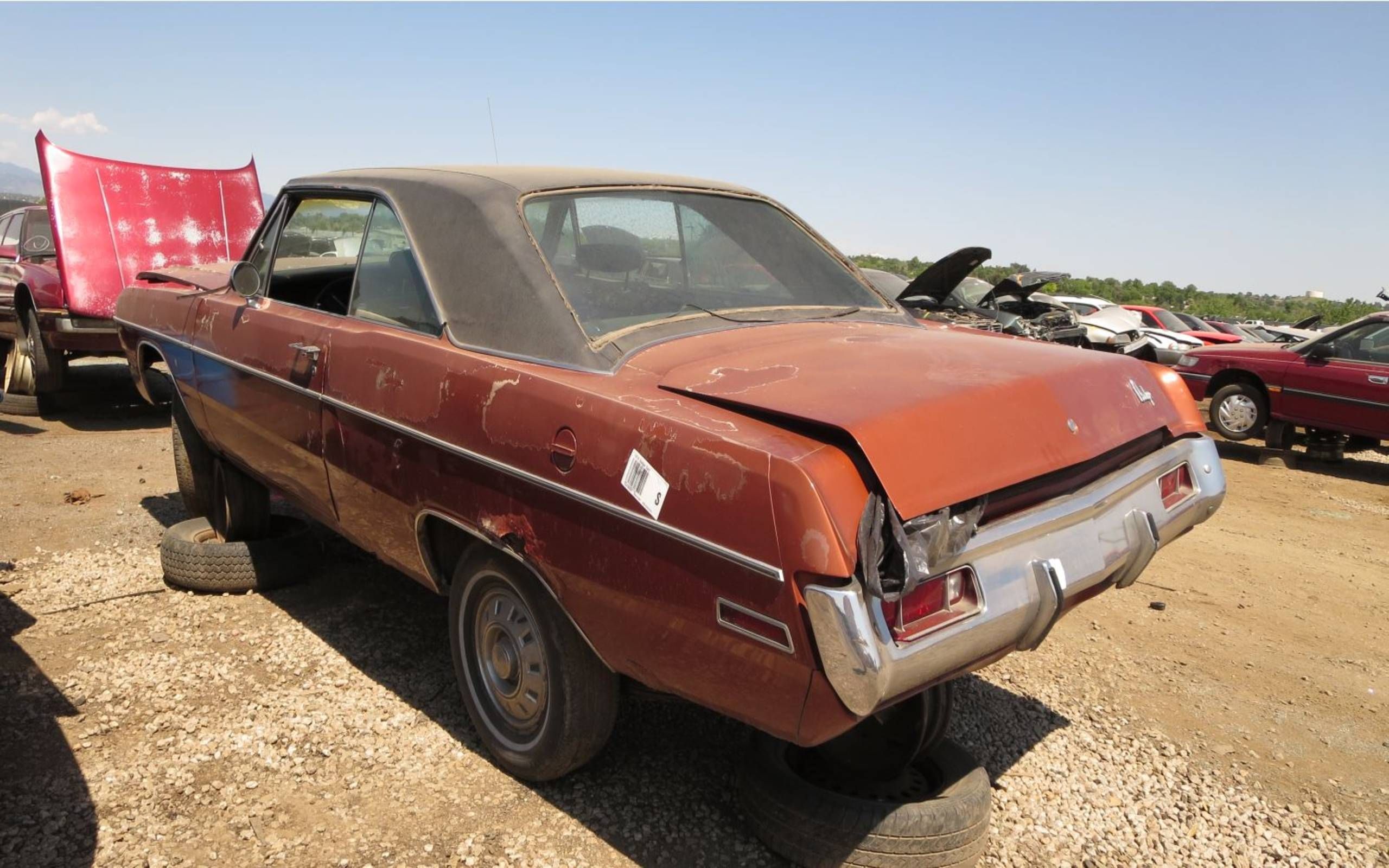 Junked 1970 Dodge Dart Swinger in Colorado wrecking yard