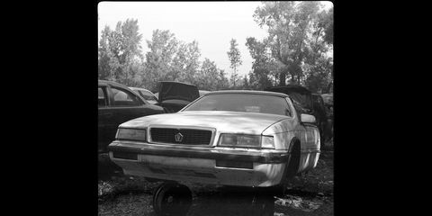 An Italianate Chrysler LeBaron in a Wisconsin wrecking yard, photographed with a 1940 Ansco Speedex film camera.