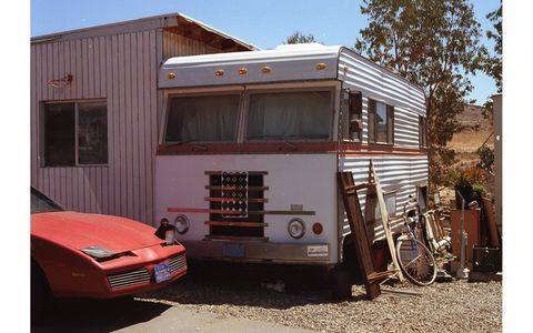According to the California Smog Check History database, this Firebird is an '84 and was last emission-tested in October of 2000. Note the Dodge camper.