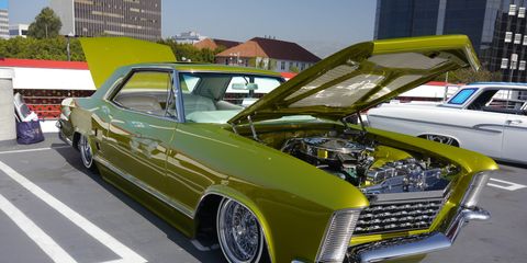 Almost 100 lowriders converged on the Petersen Automotive Museum in Los Angeles Sunday to commemorate and celebrate the museum's new exhibit, "The High Art of Riding Low." Since the exhibit opened last month, attendance has gone up 50 percent.