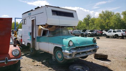 This appears to be a camper shell made for a pickup and grafted onto a cut-down Mercury.