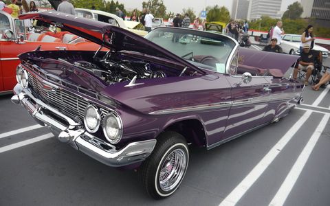 Almost 100 lowriders converged on the Petersen Automotive Museum in Los Angeles Sunday to commemorate and celebrate the museum's new exhibit, "The High Art of Riding Low." Since the exhibit opened last month, attendance has gone up 50 percent.
