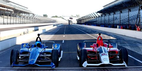 Chevrolet, left, and Honda cars on the Indianapolis Motor Speedway track Tuesday.