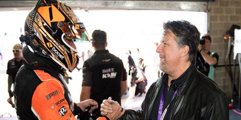 Former IndyCar driving legend and current team owner Michael Andretti, right, tours the garages at this year's Bathurst 1000.