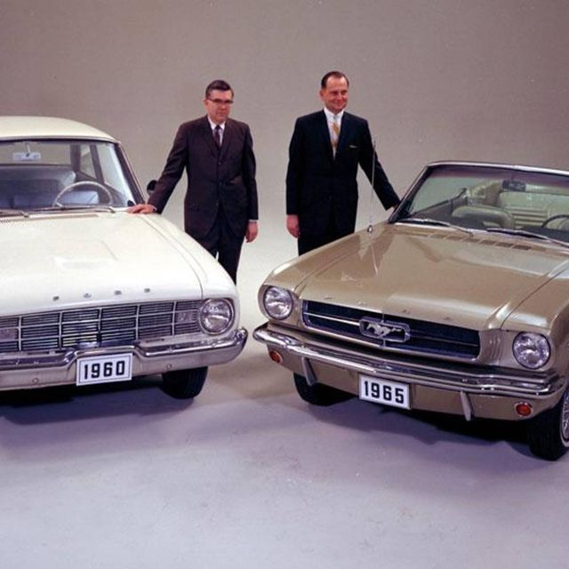 Donald Frey and Lee Iacocca are shown with key Ford products from the early 1960s--the 1960 Ford Falcon and the 1965 Ford Mustang.