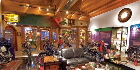 A fabrication workshop in the den is decorated like a Bavarian motorcycle dealership.