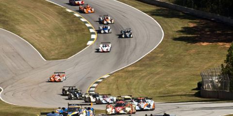 The Puegeot 908 leads the Audi R18 TDI and Peugeot 908 Hdi-FAP around Road Atlanta during Petit Le Mans on Oct. 1. Photo by: Drew Gibson/LAT Photographic