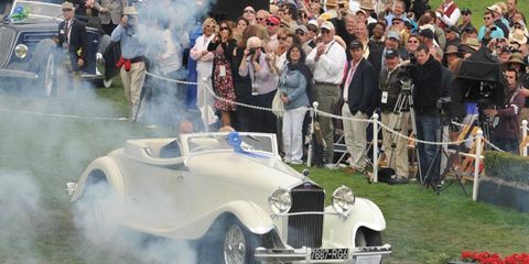 Jim Patterson drives his winning 1933 Delage D8S onto the stage at the Pebble Beach concours on Sunday.