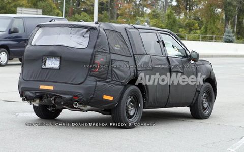 A light bar that crosses the rear hatch is a possibility, concealed under the cloaking on this 2011 Ford Explorer prototype.