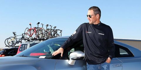 Lance Armstrong traded his bike for a fleet of Nissans during a day of testing in Arizona.