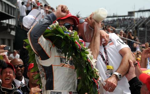 Dan Wheldon and team owner Bryan Herta celebrate with milk after Wheldon won the 2011 Indianapolis 500.
