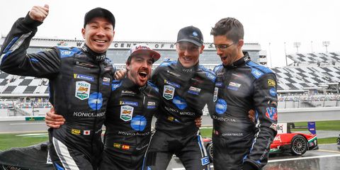 The winners celebrated at a wet Daytona International Speedway on Sunday.