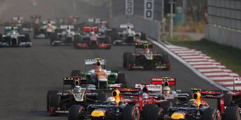2012 Korean Grand Prix: Sebastian Vettel, Red Bull RB8 Renault, and Mark Webber, Red Bull RB8 Renault, lead the field away at the start.