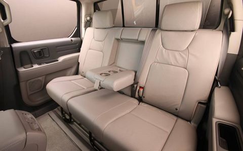 The back is big enough to fit three adults, and the rear seat fold up for added floor space.