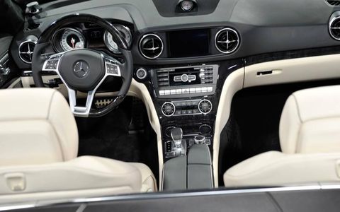 Motor vehicle, Steering part, Steering wheel, Automotive design, Vehicle audio, Center console, White, Automotive mirror, Radio, Personal luxury car, 