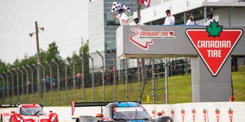 The Wayne Taylor Racing Corvette DP takes the checkered flag at Canadian Tire Motorsports Park in Ontario, Canada, on Sunday.