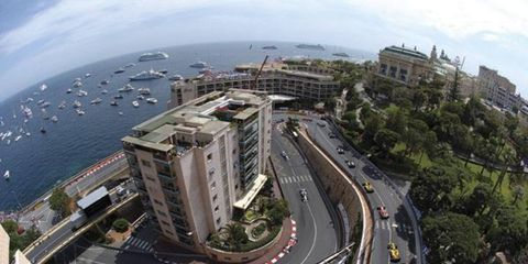 McLaren&#146;s Kimi Raikkonen leads the F1 field in Monaco on his way to the win, but eventual champion Fernando Alonso had already built a big points lead. Both left reigning champ Michael Schumacher in their wake.
