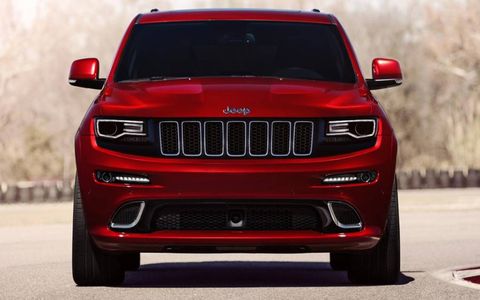 A shorter but bulkier grille and thin headlights outlined in black give the Grand Cherokee SRT a sinister stare.