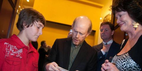 Ron Howard, center, signs autographs for fans during his visit to Austin, Texas, on Thursday.