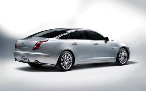 The flowing rear lines of the 2012 Jaguar XJ sedan mimic popular four-door coupe styling.