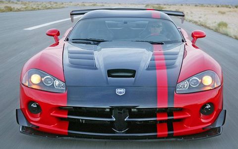 Automotive design, Vehicle, Hood, Road, Performance car, Road surface, Car, Grille, Red, Sports car, 