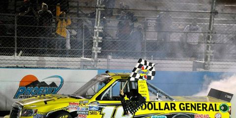 Brian Scott made a late pass to win for truck owner Kyle Busch.