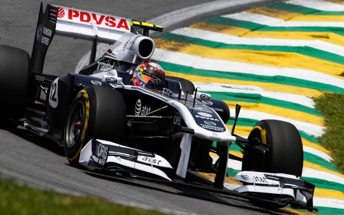 Rubens Barrichello talks to Williams team-mate Pastor Maldonado