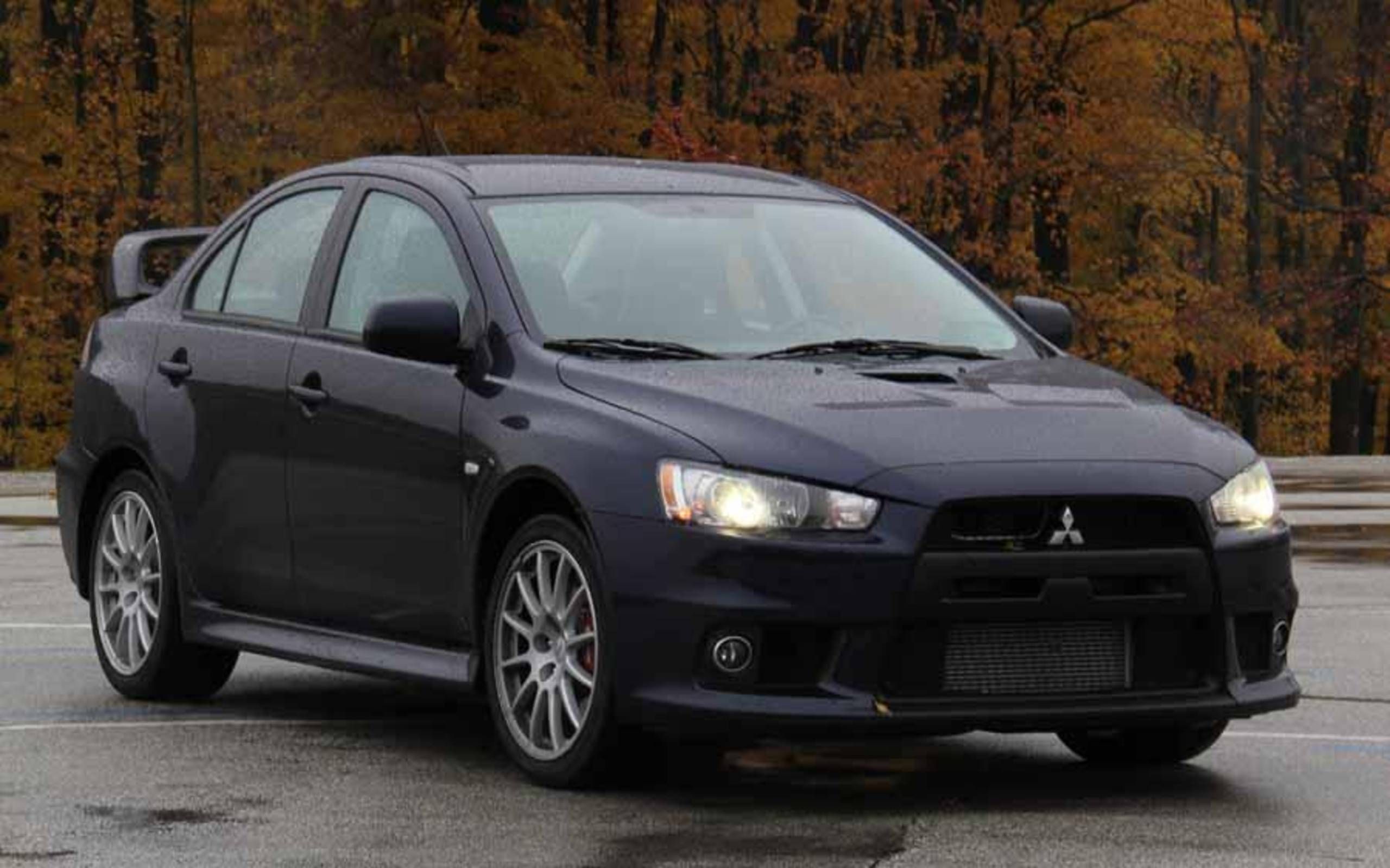 Evolution 2014. Mitsubishi Lancer Black 2014. Мицубиси ланцер 2014. Мицубиси Лансер Эволюшн 2014. Митсубиси Лансер 2014 черный.