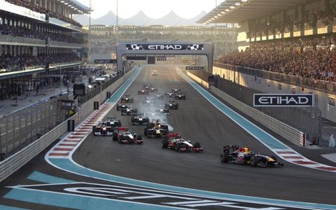 Red Bull Racing&#8217;s Sebastian Vettel leads the field into turn one at the start of the Grand Prix. Photo by: Steve Etherington/LAT Photographic