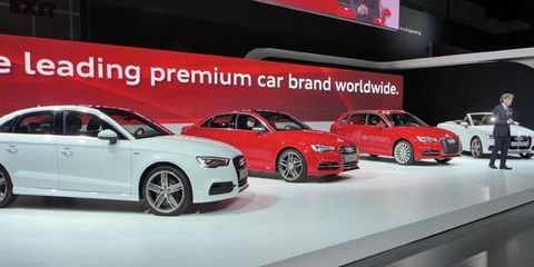 Audi sales boss Luca de Meo in front of the happy A3 family.