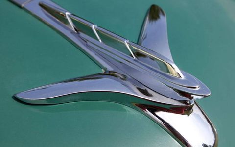 Not even wings can hide the prow and highly stylized sails on the 1951 Plymouth Cambridge sedan's hood ornament.