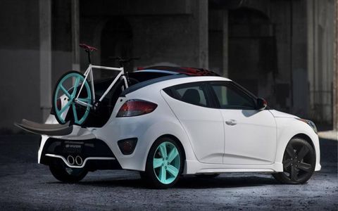 The Hyundai Veloster C3 Roll Top concept attempts to capitalize on the nationwide fixed-gear bike craze that you may or may not be aware of. The car, which was debuted at the LA Auto Show, features a fabric convertible top and a cargo area meant for transporting a bicycle.