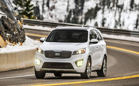 The 2017 Kia Sorento SXL is shown, which adds chrome 19-inch wheels and LED front fog lights.