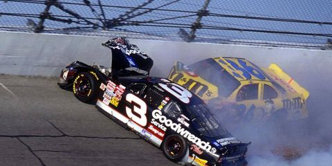 The car of Ken Schrader hits Dale Earhardt's car as Earhardt hits the wall head-on on the last lap of the 2001 Daytona 500.