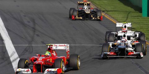 Felipe Massa, left, fought tire issues and his day ended early when he collided with Bruno Senna.