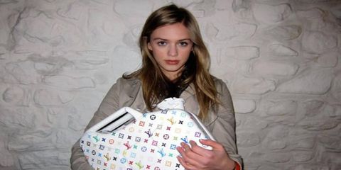 Model Remy Green holds a DSC custom Louis Vuitton-styled gas can.