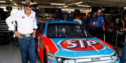 Richard Petty shows off the STP NASCAR Ford Fusion at Kansas Speedway in 2011. The car will sport a similar color scheme in April at Kansas.