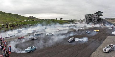 For more than 15 seconds, 75 cars burned rubber in the raceway's main paddock.