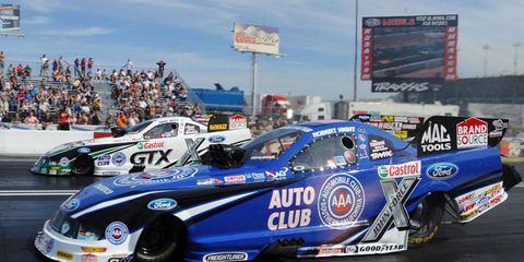 Robert Hight, near, had the fastest Funny Car during the first day of qualifying in Las Vegas.