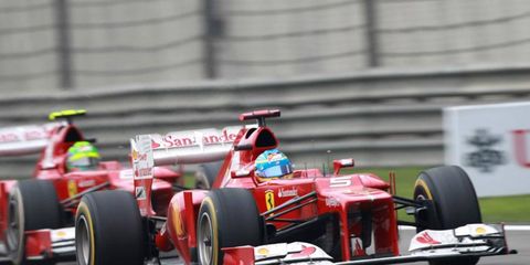 Fernando Alonso fell from first to third in the Formula One points chase after a ninth-place finish in China.