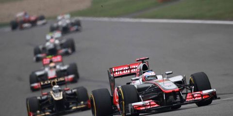 Jenson Button finished second in China but took over the Formula One points lead.
