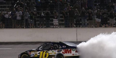 Greg Biffle won Saturday night's NASCAR Sprint Cup race in Texas, spoiling a bid by Jimmie Johnson to win Hendrick Motorsports' 200th race.