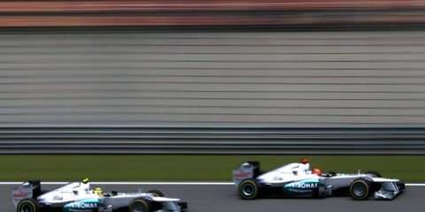 Nico Rosberg passes Michael Schumacher during Formula One qualifying on Saturday in Shanghai.