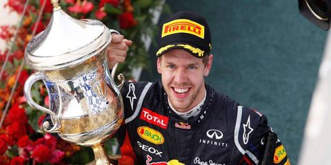 Two-time defending Formula One world champion Sebastian Vettel broke through on Sunday with his first win of the season.