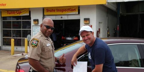 A Virginia sheriff's deputy verified the drive and unsealed the fuel tank after John and Helen Taylor drove 1,626.1 miles on one tank of diesel.
