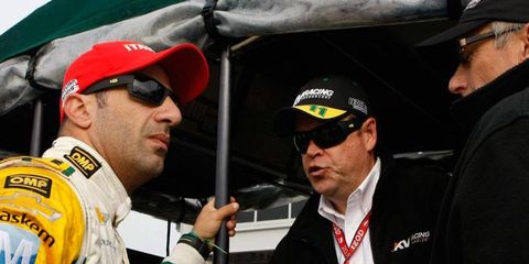 Izod IndyCar Series driver Tony Kanaan, left, talks with engineers at a recent race. Kanaan will be in Detroit on May 9 to help promote the upcoming Chevrolet Detroit Belle Isle Grand Prix.