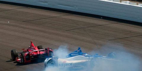 Takuma Sato starts to spin after contact with Dario Franchitti on the final lap of the Indianapolis 500.