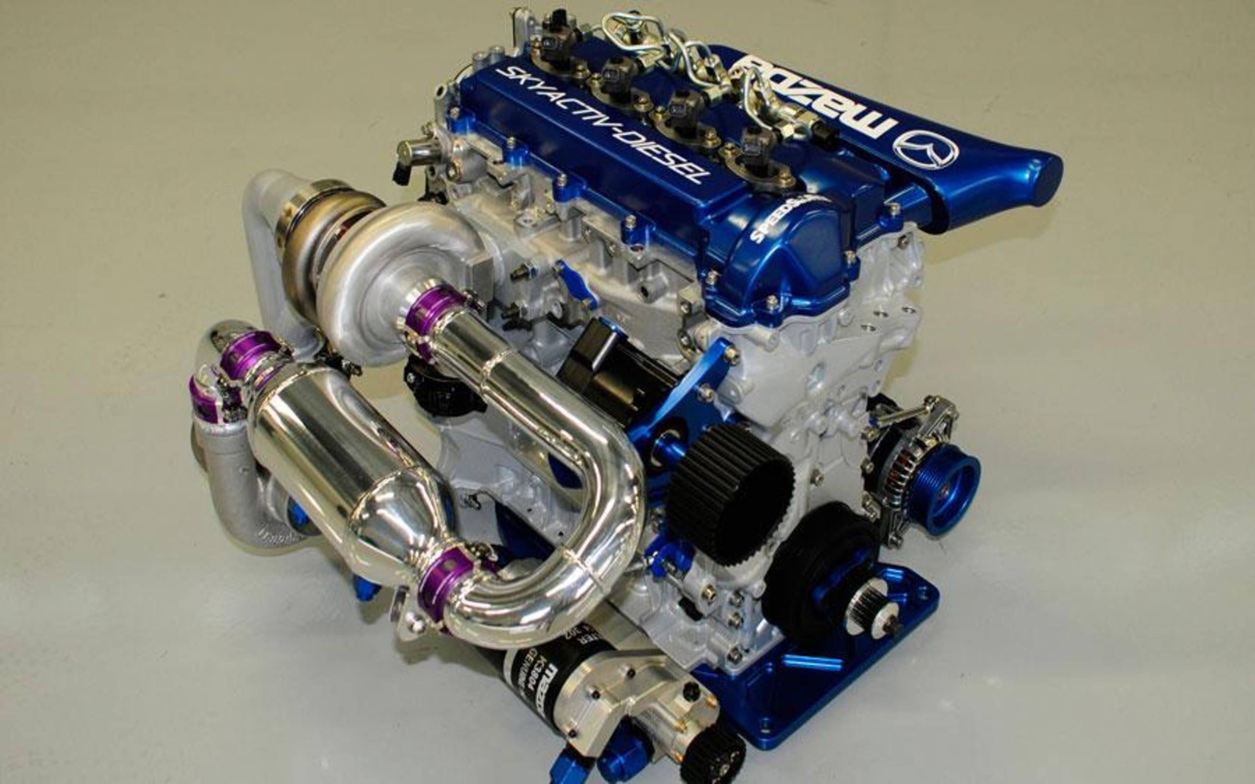 Самые эффективные двигатели. Mazda SKYACTIV-D. Mazda lmp2. Mazda SKYACTIV-D lmp2. Мазда 30 скайактив дизель.